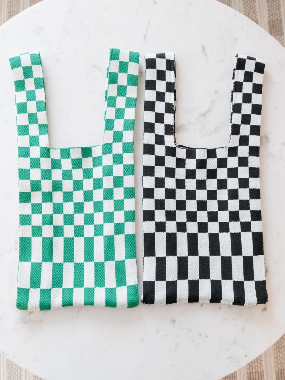 Two Checkered knit shopping tote bags Black and white and green and white.